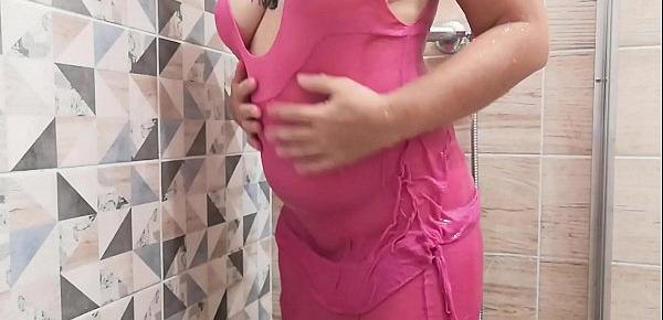  MILF teases you in a see-through dress in the shower and masturbates to a strong orgasm.
